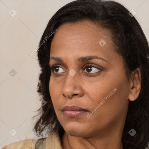 Neutral black young-adult female with medium  brown hair and brown eyes