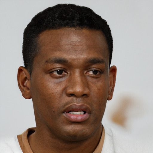 Neutral black young-adult male with short  black hair and brown eyes