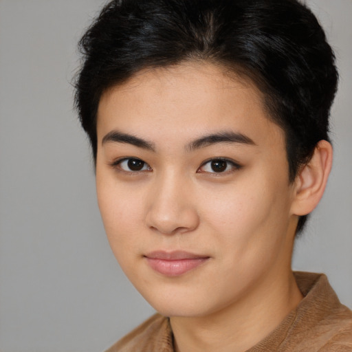 Joyful asian young-adult female with short  brown hair and brown eyes