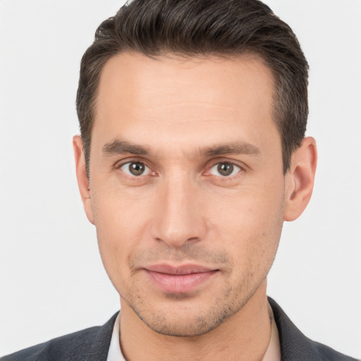 Joyful white young-adult male with short  brown hair and brown eyes