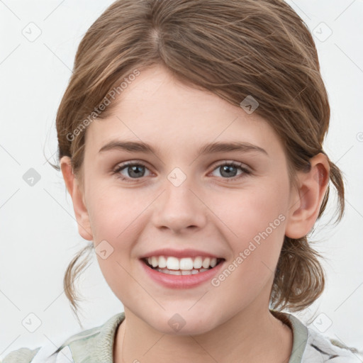 Joyful white child female with medium  brown hair and grey eyes