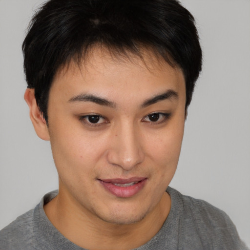 Joyful asian young-adult female with short  brown hair and brown eyes