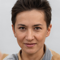 Joyful white adult female with short  brown hair and brown eyes