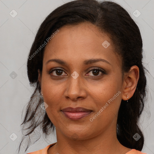 Joyful black young-adult female with medium  brown hair and brown eyes