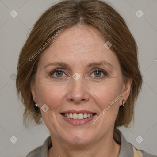 Joyful white adult female with medium  brown hair and blue eyes