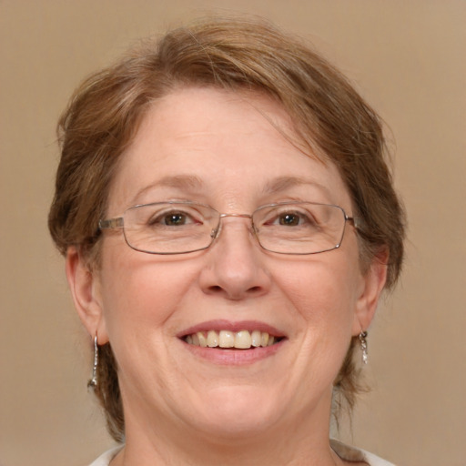 Joyful white middle-aged female with medium  brown hair and blue eyes