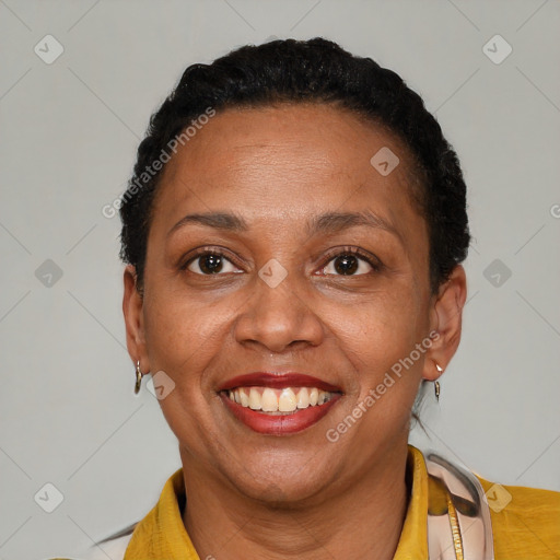Joyful black adult female with short  brown hair and brown eyes