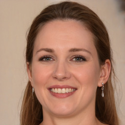 Joyful white young-adult female with long  brown hair and grey eyes