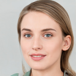 Joyful white young-adult female with long  brown hair and blue eyes