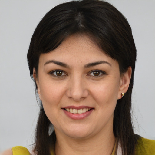 Joyful white young-adult female with medium  brown hair and brown eyes