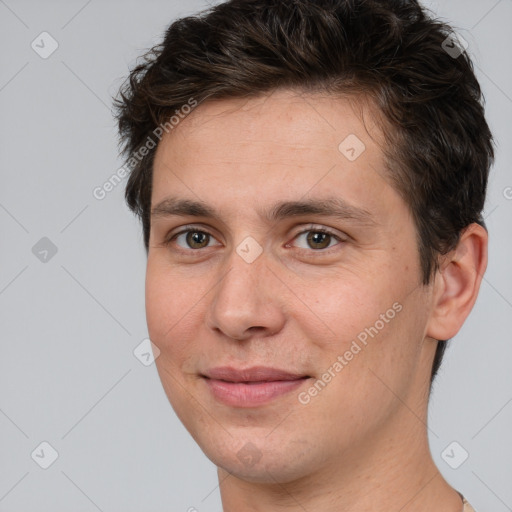 Joyful white adult male with short  brown hair and brown eyes