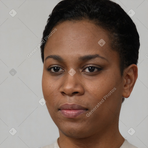 Joyful black young-adult female with short  black hair and brown eyes