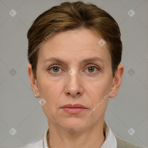 Joyful white adult female with short  brown hair and grey eyes