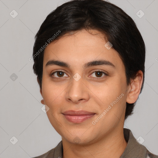 Joyful latino young-adult female with medium  brown hair and brown eyes