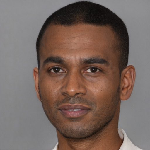 Neutral black young-adult male with short  black hair and brown eyes
