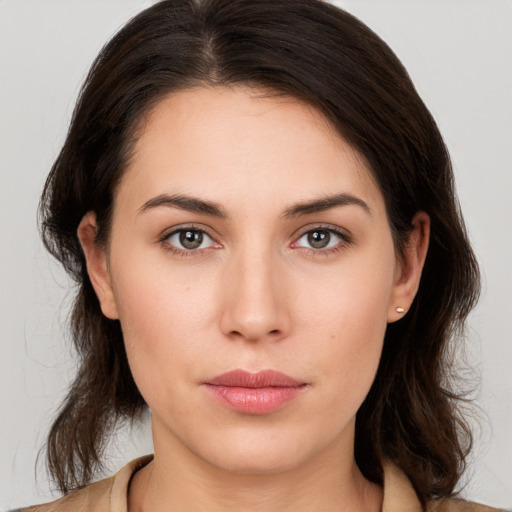 Neutral white young-adult female with medium  brown hair and brown eyes