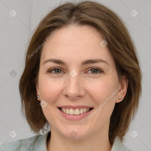 Joyful white adult female with medium  brown hair and grey eyes