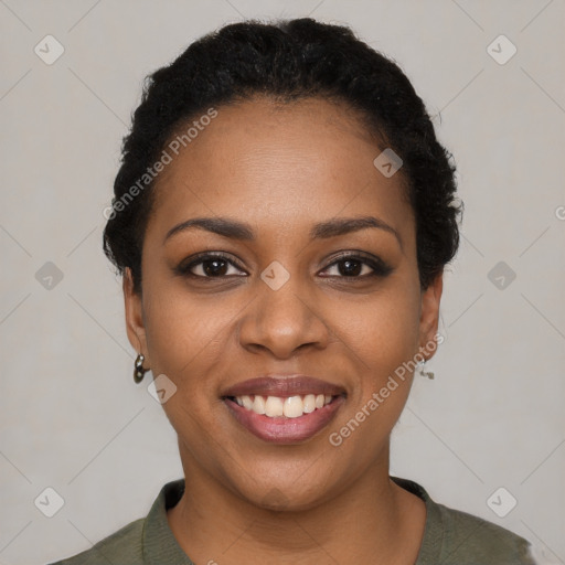 Joyful black young-adult female with short  black hair and brown eyes