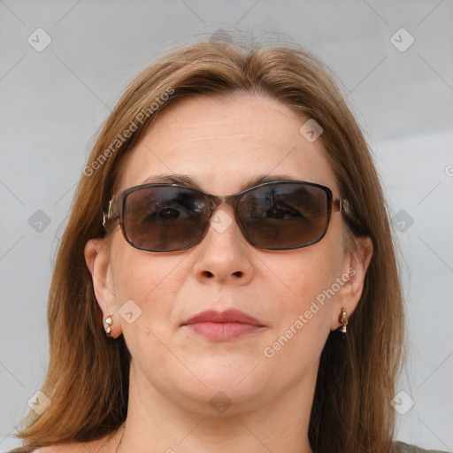 Joyful white adult female with medium  brown hair and brown eyes