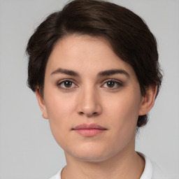 Neutral white young-adult female with short  brown hair and brown eyes