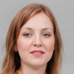 Joyful white young-adult female with medium  brown hair and blue eyes