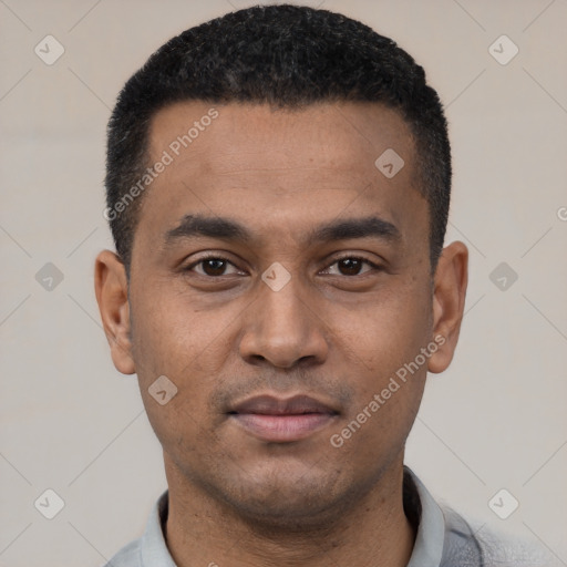 Neutral latino young-adult male with short  black hair and brown eyes