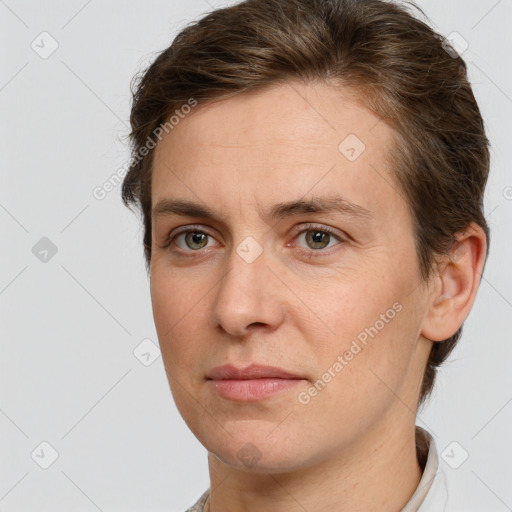 Joyful white adult female with short  brown hair and brown eyes