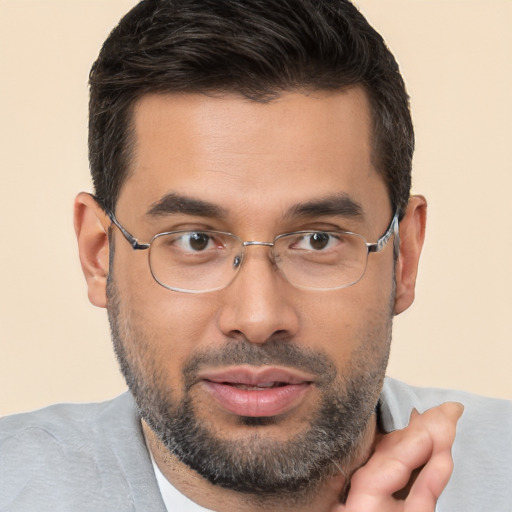 Joyful white adult male with short  brown hair and brown eyes