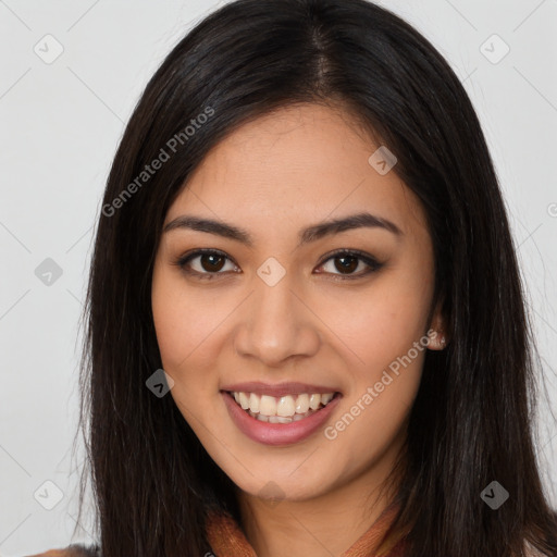 Joyful latino young-adult female with long  brown hair and brown eyes