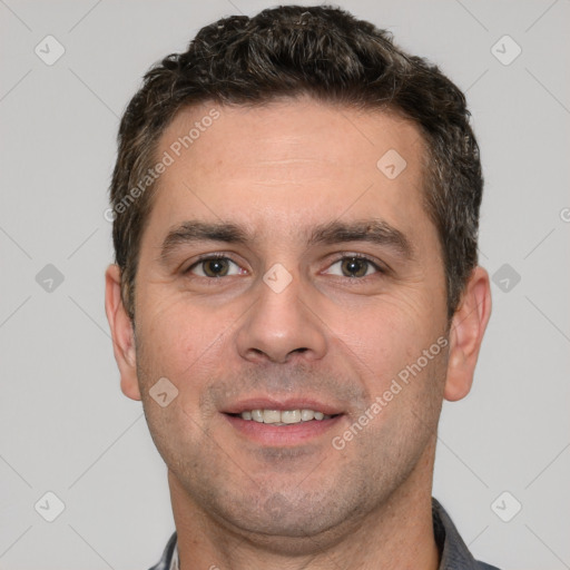 Joyful white young-adult male with short  brown hair and brown eyes