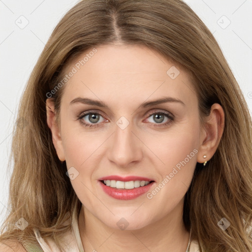 Joyful white young-adult female with long  brown hair and blue eyes