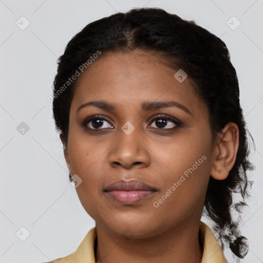 Joyful black young-adult female with medium  black hair and brown eyes