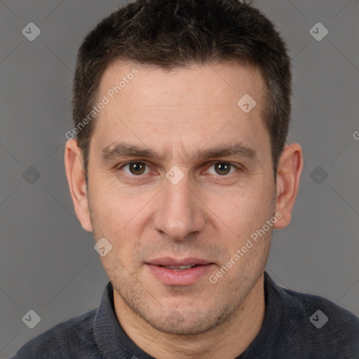 Joyful white adult male with short  brown hair and brown eyes