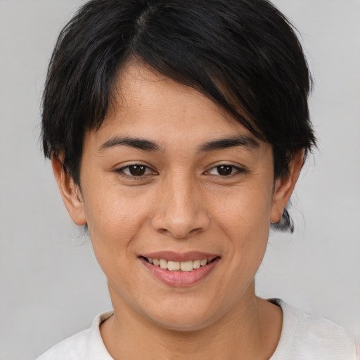 Joyful asian young-adult female with medium  brown hair and brown eyes