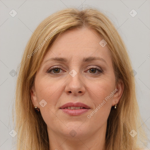 Joyful white adult female with long  brown hair and brown eyes