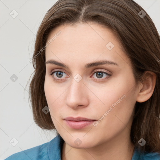 Neutral white young-adult female with medium  brown hair and blue eyes