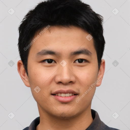 Joyful asian young-adult male with short  black hair and brown eyes