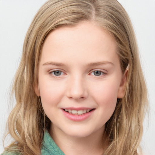 Joyful white child female with medium  brown hair and green eyes