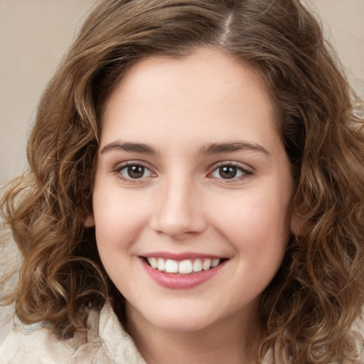 Joyful white young-adult female with medium  brown hair and green eyes