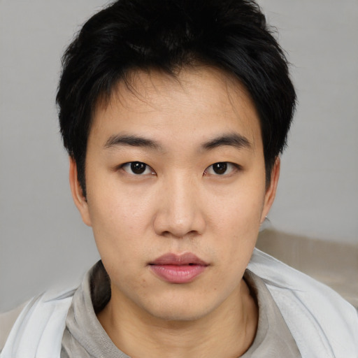 Neutral asian young-adult male with short  black hair and brown eyes