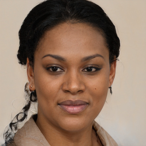Joyful black young-adult female with medium  brown hair and brown eyes