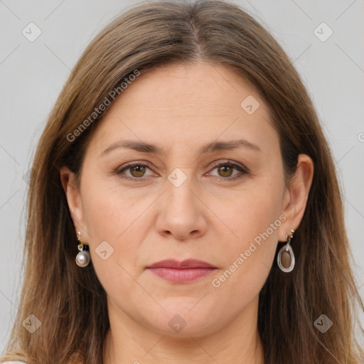 Joyful white adult female with long  brown hair and brown eyes