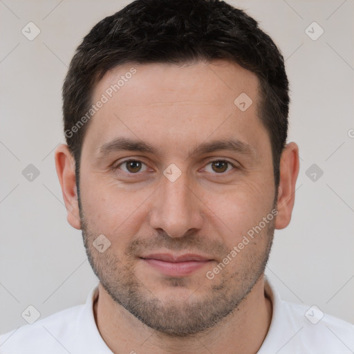 Joyful white young-adult male with short  brown hair and brown eyes