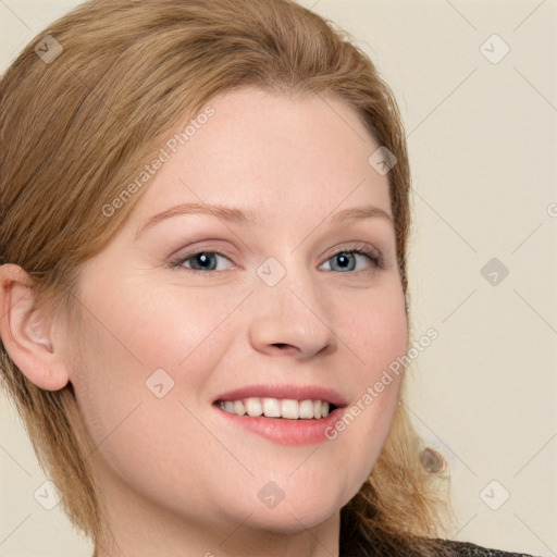 Joyful white young-adult female with long  brown hair and blue eyes