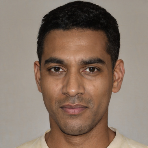 Neutral black young-adult male with short  black hair and brown eyes