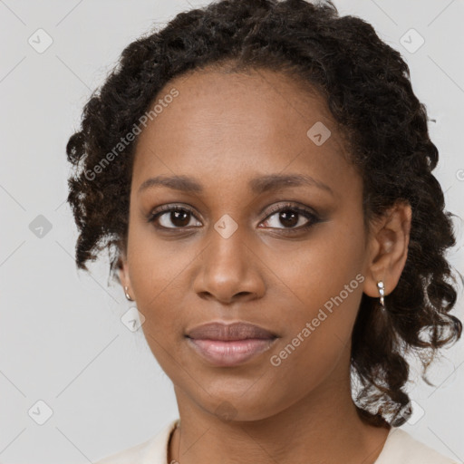 Neutral black young-adult female with medium  brown hair and brown eyes