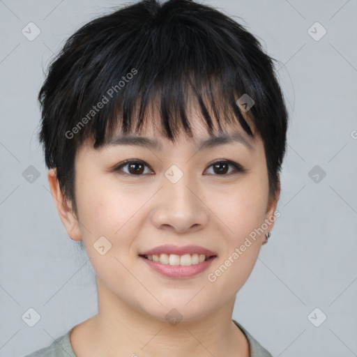 Joyful asian young-adult female with short  brown hair and brown eyes