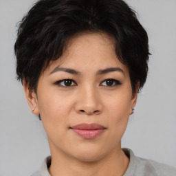 Joyful asian young-adult female with short  brown hair and brown eyes