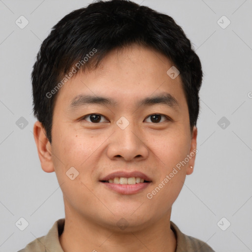 Joyful asian young-adult male with short  brown hair and brown eyes