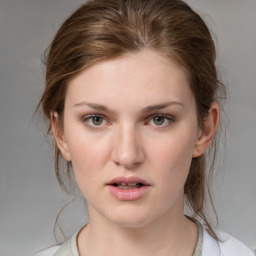 Neutral white young-adult female with medium  brown hair and brown eyes